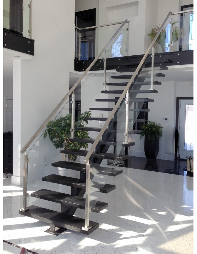 Floating wooden staircase with glass railing and stainless steel handrails & posts
