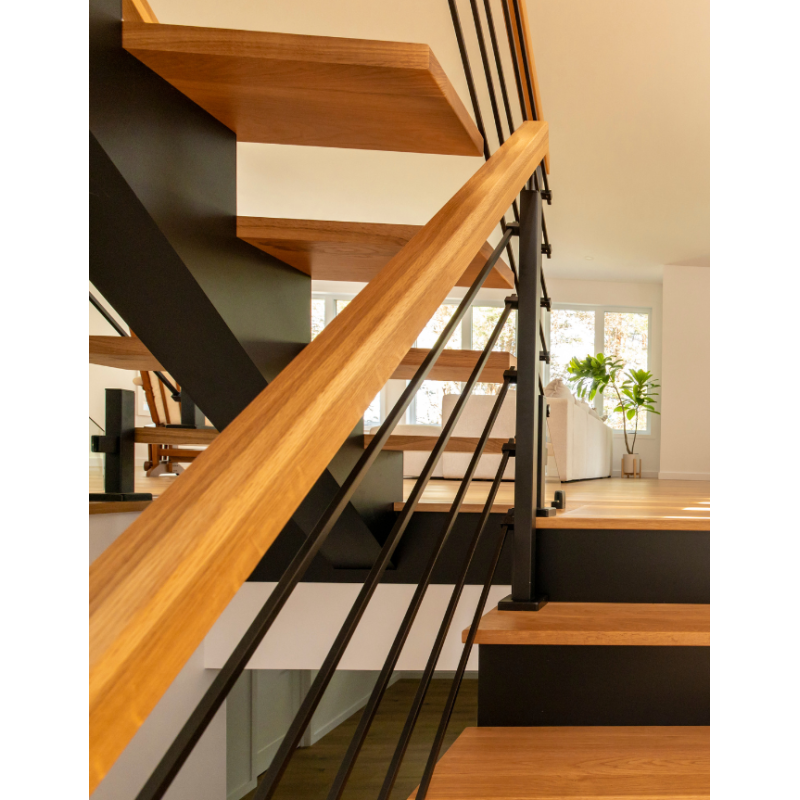 Floating multi-landing wood staircase with rod railings and central ...